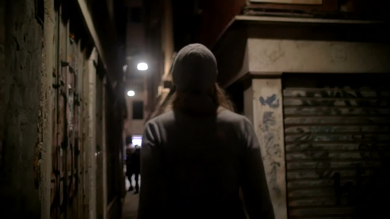 Download Stock Footage Woman Walking Down An Old Street Live Wallpaper Free