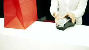 Stock Footage Woman Pays Cashier With Credit Card In Shop Live Wallpaper Free