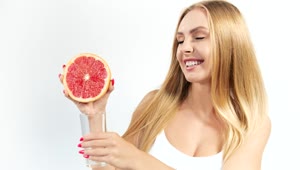 Download Stock Footage Woman Squeezing A Grapefruit Live Wallpaper Free