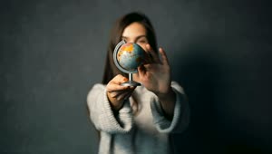 Stock Footage Woman Spins A Small World Globe Live Wallpaper Free