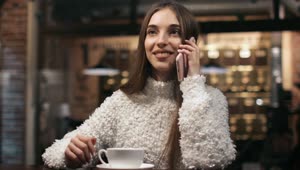 Stock Footage Woman Talking On The Phone In A Coffee Shop Live Wallpaper Free