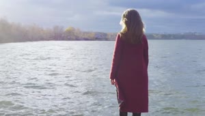 Stock Footage Woman Standing At The Edge Of A Cold Lake Live Wallpaper Free