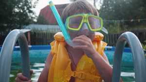 Stock Footage Young Boy With Inflatable Vest And Snorkel Equipment Live Wallpaper Free