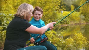 Stock Footage Woman Teaching A Boy To Fish Live Wallpaper Free