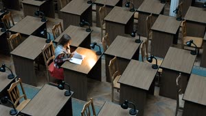 Stock Footage Woman Reading Alone In Study Hall Live Wallpaper Free