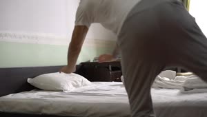 Stock Footage Young Guy Dives Into Bed And Pulls Covers Up Live Wallpaper Free