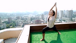 Stock Footage Woman Doing Yoga Pose On Rooftop With City Panorama Live Wallpaper Free
