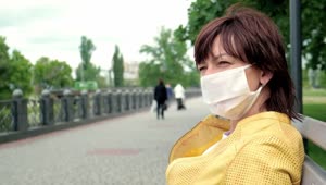 Stock Footage Woman Wearing Face Mask On Park Bench Live Wallpaper Free