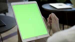 Stock Footage Woman Holding A Tablet With A Green Screen Live Wallpaper Free