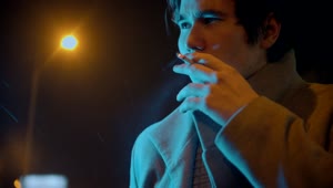 Stock Footage Young Stylish Man With A Coat Smoking A Cigarette Outdoors Live Wallpaper Free
