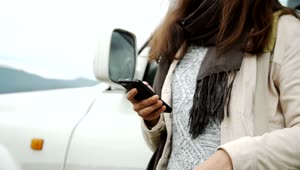 Stock Footage Woman Using Mobile Gps Outside Car Live Wallpaper Free