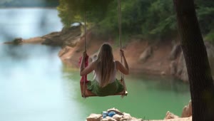 Stock Footage Woman On A Swing By The Lake Live Wallpaper Free