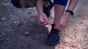Stock Footage Woman Tying Her Shoes Live Wallpaper Free