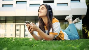Stock Footage Young Woman Listens To Inspiring Music On Headphones Live Wallpaper Free