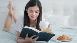 Stock Footage Woman Enjoys Book And Breakfast In Bed Live Wallpaper Free