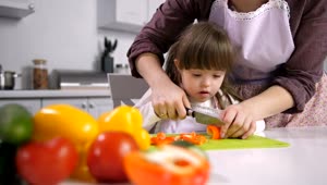 Download Stock Footage Young Girl Cutting Peppers Live Wallpaper Free