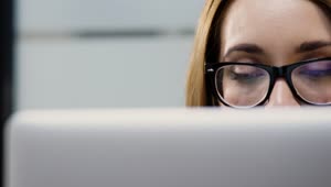 Stock Footage Woman With Glasses Working On A Computer Live Wallpaper Free