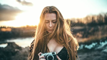 girl holding camera wallpaper