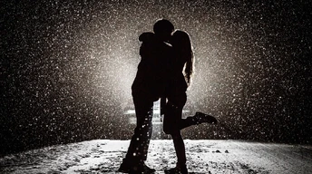 couple kissing in snow wallpaper