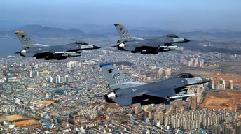 f 16 fighting falcons over city widescreen wallpapers