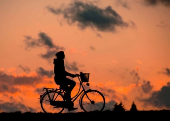 cyclist chasing sky wallpaper