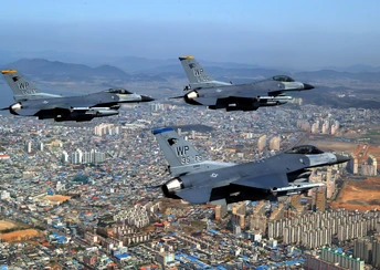 f 16 fighting falcons over city widescreen wallpapers