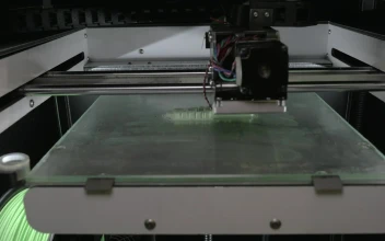 Stock Video 3d printing a white object PC