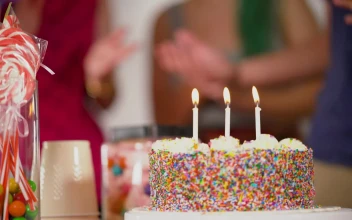 Stock Video A Birthday Man Blows Out The Candles On His Cake for PC