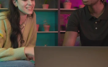 Stock Video A Boy And A Girl Shopping Online for PC