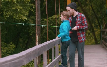 Stock Video A Boy And A Man Fishing On A Bridge In for PC
