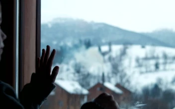 Stock Video A Boy Draws Imaginary Shapes On Window for PC