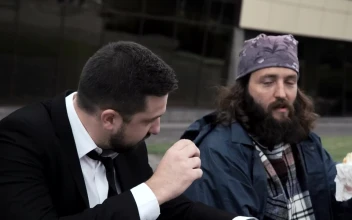 Stock Video A Business Man And Homeless Eating Together for PC
