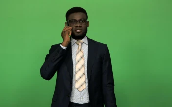 Stock Video A Businessman In A Suit Talking On The Phone for PC