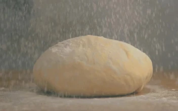Stock Video A Chef Covering Dough With Flour for PC