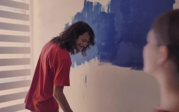 Stock Video A Couple In Love Painting A Wall for PC
