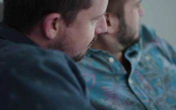 Stock Video A Couple Is Sitting Together On A Couch for PC