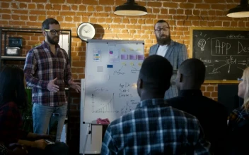 Stock Video A Couple Of Man Explaining App Software Design for PC