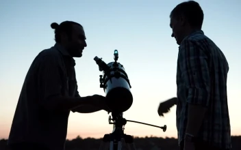 Stock Video A Couple Of Man Using A Telescope At Dawn for PC