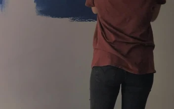 Stock Video A Couple Painting A Wall Blue for PC