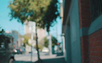 Stock Video A Cyclist Parking His Bicycle In The Street for PC