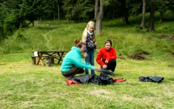 Stock Video A Family Setting Up A Camping Tent for PC