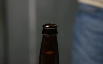 Stock Video Adding And Sealing A Beer Cap To The Bottle for PC