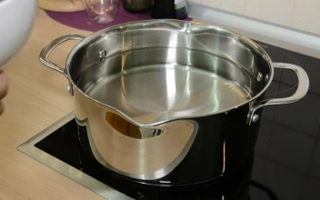 Stock Video Adding Cut Mushrooms To A Pan for PC