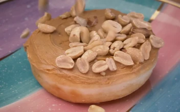 Stock Video Adding Peanuts To A Peanut Butter Donut for PC