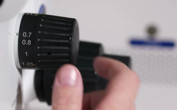 Stock Video Adjusting The Zoom On A Microscope for PC