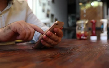 Stock Video Adult Man In A Restaurant Viewing His Cell for PC