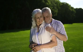 Stock Video Adult Man And Woman Embracing On A Meadow for PC