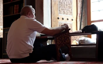Stock Video Adult Man Reading The Quran Inside A Mosque for PC