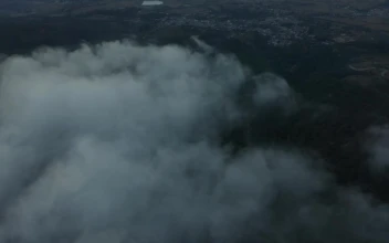 Stock Video Aerial Panorama Of A Natural Relief Covered By Clouds for PC