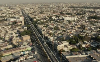 Stock Video Aerial Panorama Of A Train Crossing A Big City for PC